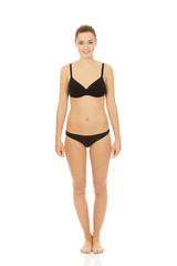 Fototapeta premium Happy woman standing in bikini.