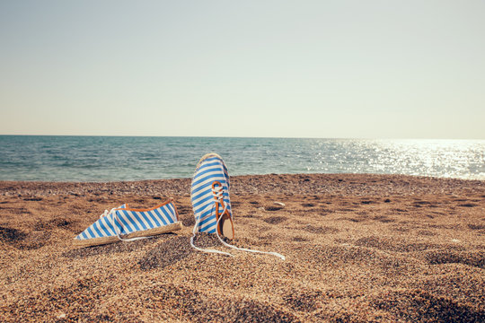 Pair of shoes on the coast