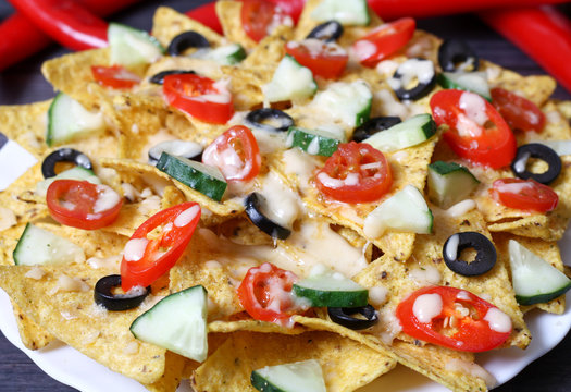 Mexican hot nachos with vegetables and chili