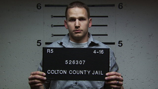 A man being booked for a crime