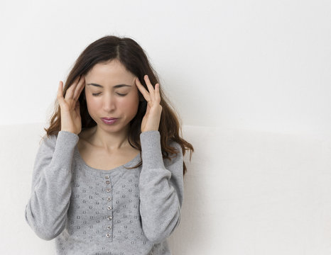 Stressed woman has headache