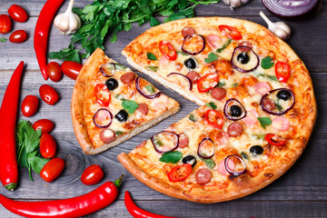 pizza with sausage, olives and chili pepper