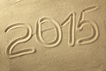 2015 written on the sand of the beach