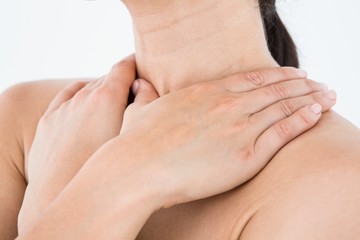 Sick brunette having throat pain