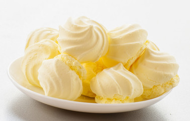 French vanilla meringue cookies on white background