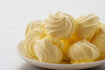 French vanilla meringue cookies on white background