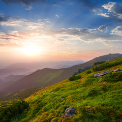 green mount slope at the sunset