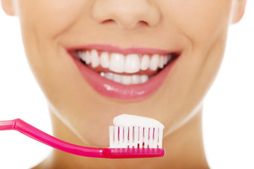 Woman with a toothbrush.