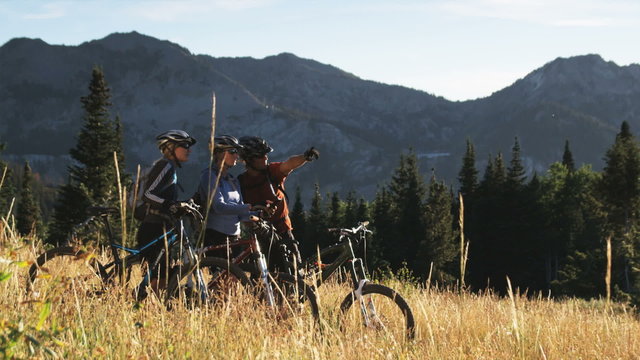 three mountain bikers on the trail