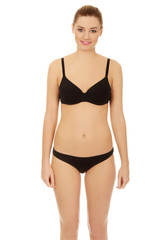 Fototapeta premium Beautiful woman standing in bikini.