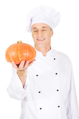 Male chef with a pumpkin