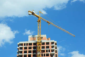 Building crane  with clouds and blue  sky background