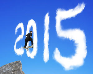 Skateboarding businessman passing through 2015 shape cloud on bl