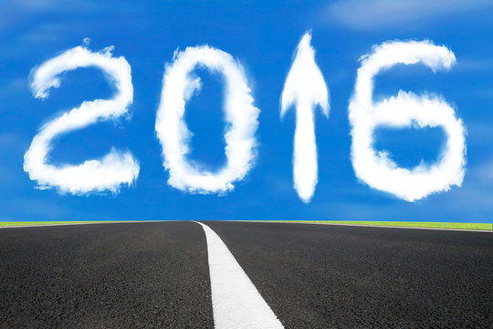 2016 year arrow up sign shape clouds with asphalt road
