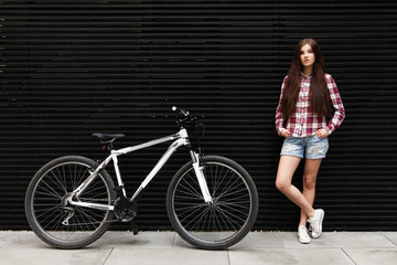 Plakat Young beautiful woman on a bicycle