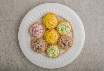 Cupcakes with colorful sweet cream