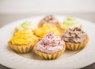 Cupcakes with colorful sweet cream