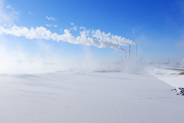 Fototapeta na wymiar Hydroelectric power plant in winter