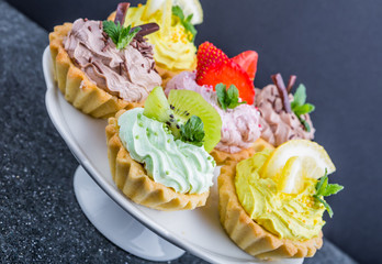 Small biscuits with fruits and sweet cream
