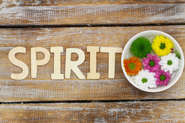 Spirit written with wooden letters and Santini flowers