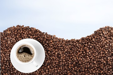 Coffee. Cup of coffee on beans