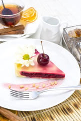 piece of cherry pie on a table in a restaurant