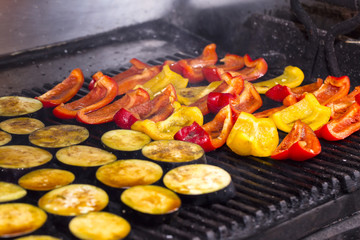 cooking vegetables on the grill in the kitchen at the restaurant