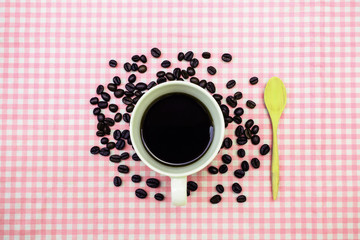 Cup of coffee with coffee bean