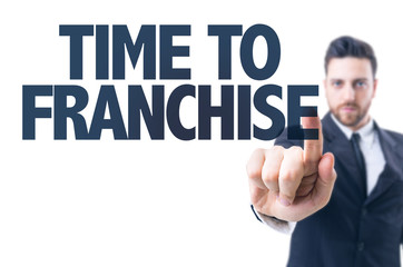 Business man pointing the text: Time to Franchise