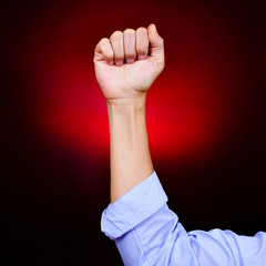 raised fist of a young man