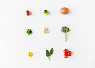close up of ripe vegetables and food over white