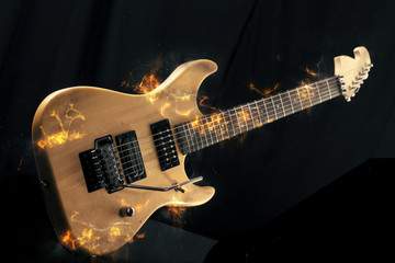 Obraz na płótnie Canvas Electric Guitar on fire on Black Background