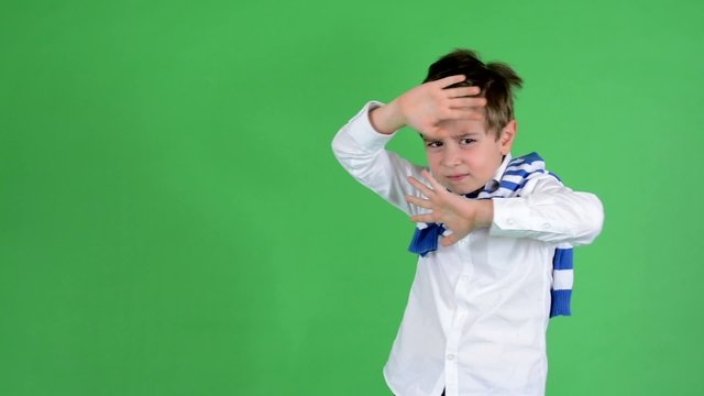 child boy is scared (defends) - green screen