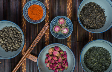 Chinese Bowls filled with different kinds of Tea decorated with