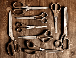 set of old scissors on a wooden  background