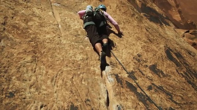 MS LA Woman rock climbing / Moab, Utah, USA