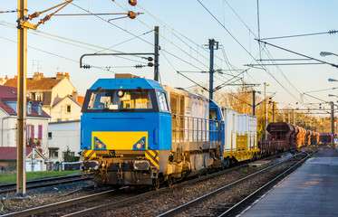 Diesel locomotive hauling a freight train at Montbeliard station