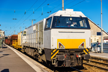 Diesel locomotive hauling a freight train at Besancon station -