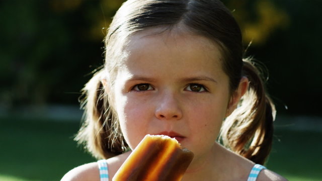 girl eating a popsicle