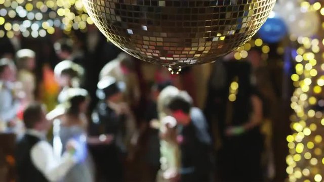 MS R/F Couples dancing on prom night under disco ball / Cedar Hills, Utah, USA
