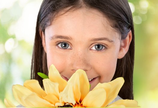 Child. Little Girl with a Sunflower