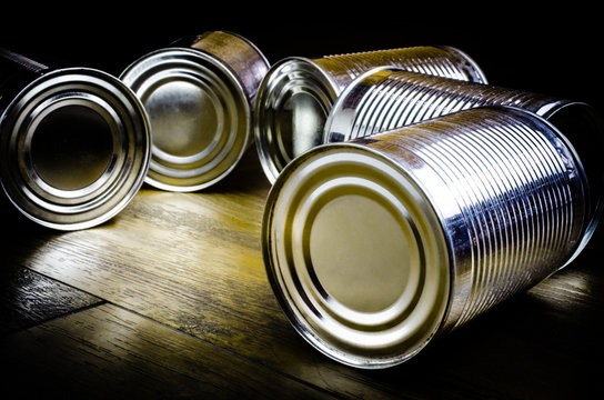 Aluminum cans on wooden background