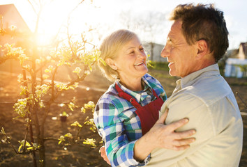 Senior couple enjoying a moment in their garden