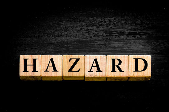 Word HAZARD isolated on black background