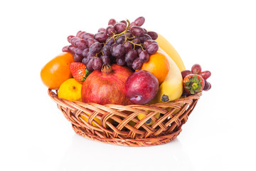 fruit in basket isolated on white background