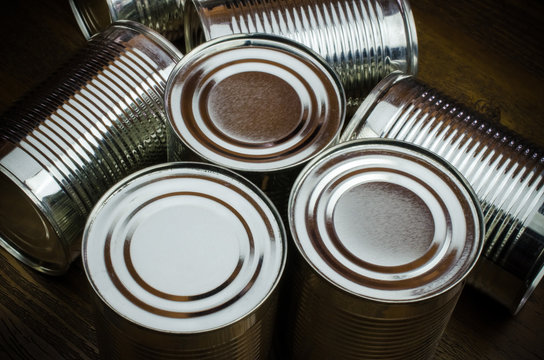 Aluminum cans on wooden background