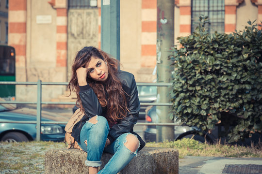 Beautiful girl posing in an urban context