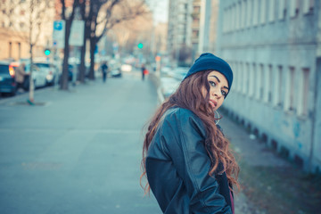 Fototapeta premium Beautiful girl posing in an urban context
