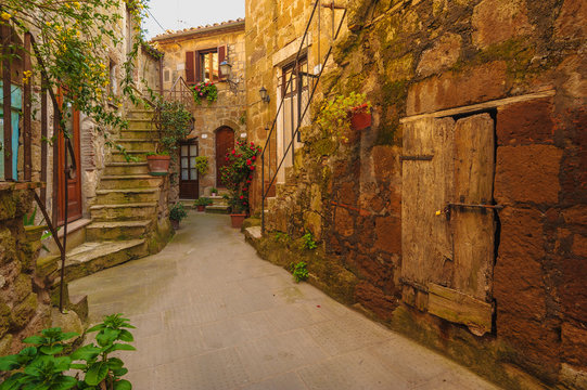 Fototapeta Italian old ancient alley in the medieval Tuscan town