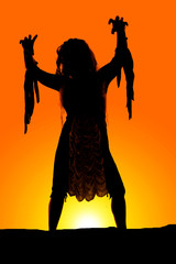 silhouette of a woman reach forward grabbing